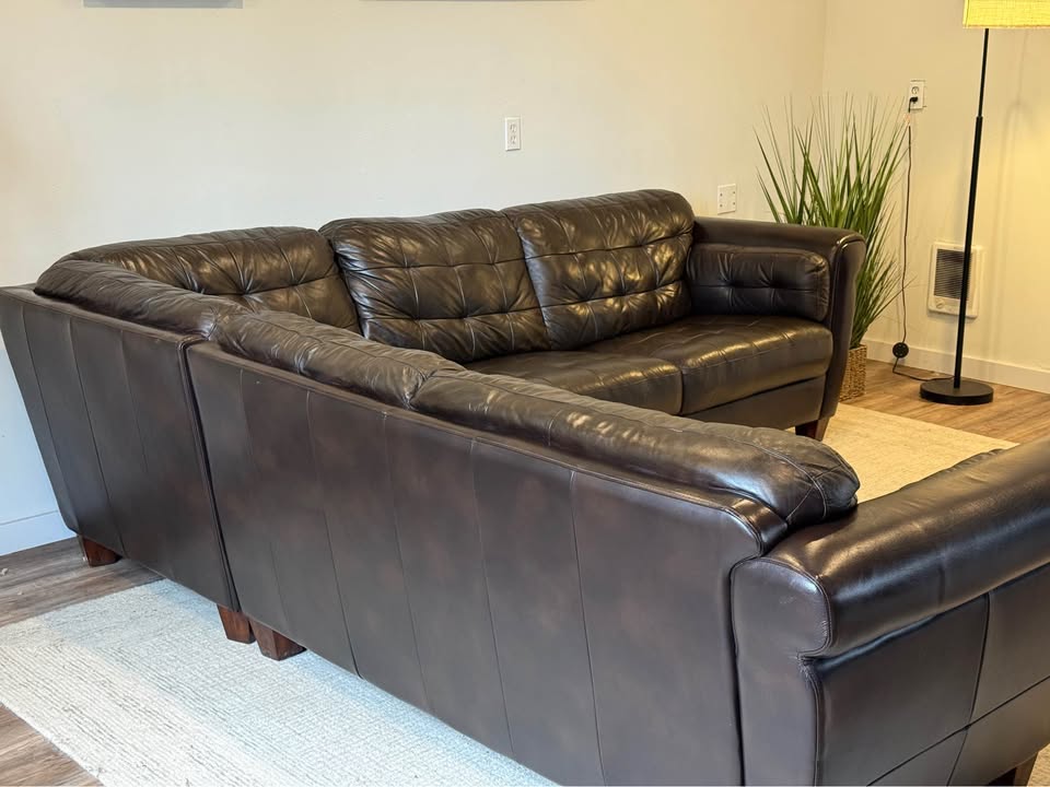 Sheldon’s dark brown leather sectional couch delivery available