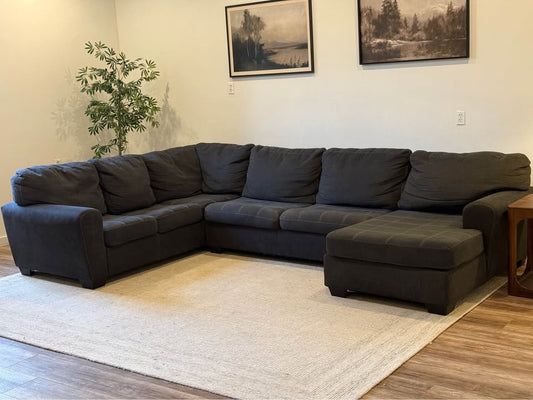 Dark gray sectional couch delivery available